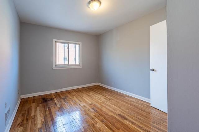 unfurnished room featuring light hardwood / wood-style floors