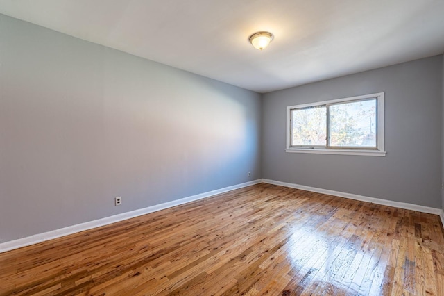 empty room featuring hardwood / wood-style flooring