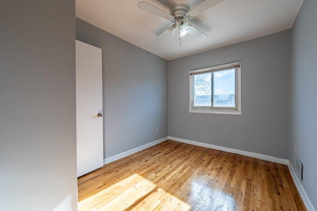 spare room with ceiling fan and light hardwood / wood-style flooring