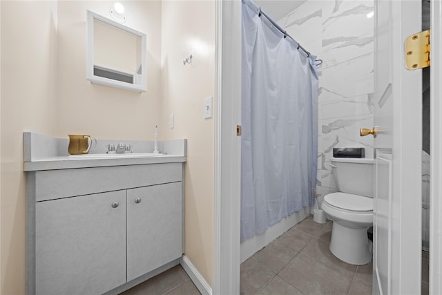 full bathroom with toilet, vanity, shower / tub combo, and tile patterned flooring