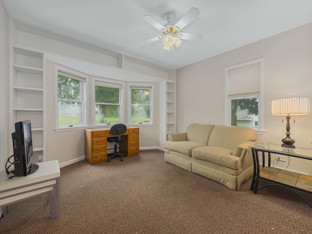 office space with carpet floors, ceiling fan, and plenty of natural light