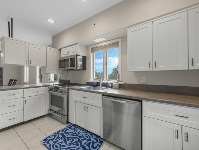 kitchen featuring sink, white cabinetry, and appliances with stainless steel finishes