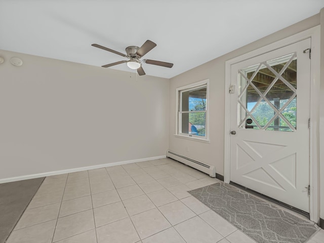 doorway featuring ceiling fan, baseboard heating, and light tile patterned floors