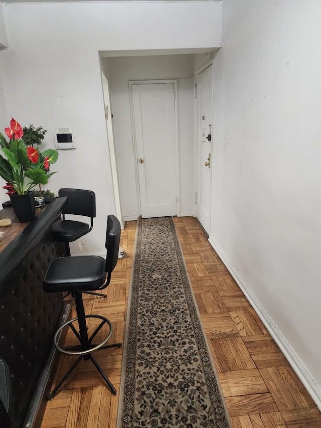 hallway with light parquet flooring