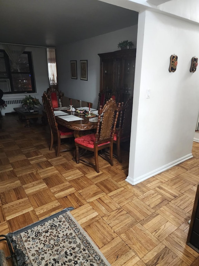 dining area with light parquet floors