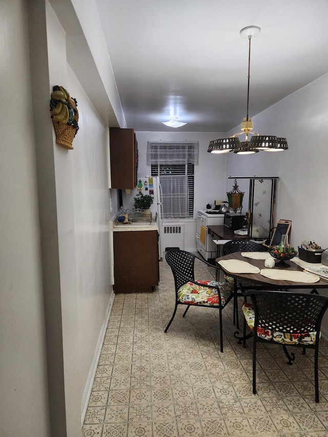 dining room with radiator heating unit