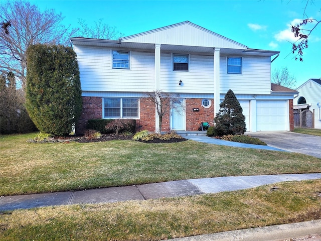 view of front of property featuring a garage and a front lawn