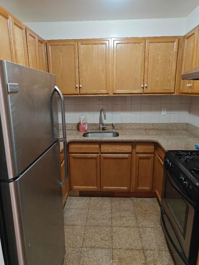41-38 66th St Unit 2B, Woodside, NY 11377 - kitchen with freestanding refrigerator, a sink, gas range oven, and tasteful backsplash