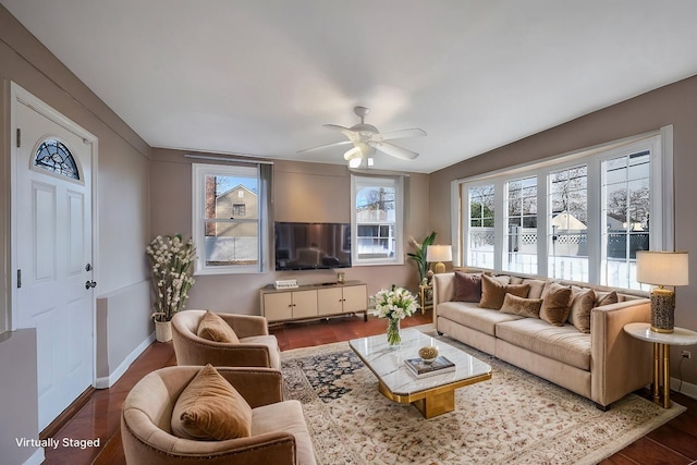 living room featuring dark hardwood / wood-style flooring and ceiling fan