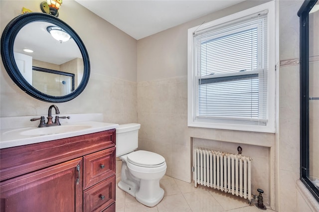 bathroom with a shower with door, tile walls, tile patterned flooring, radiator heating unit, and toilet