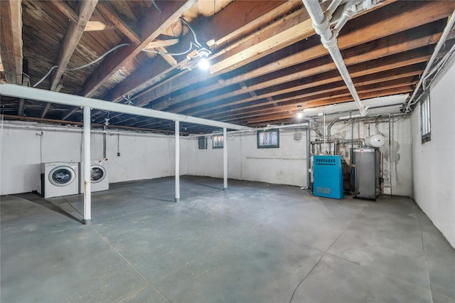 basement featuring separate washer and dryer and gas water heater