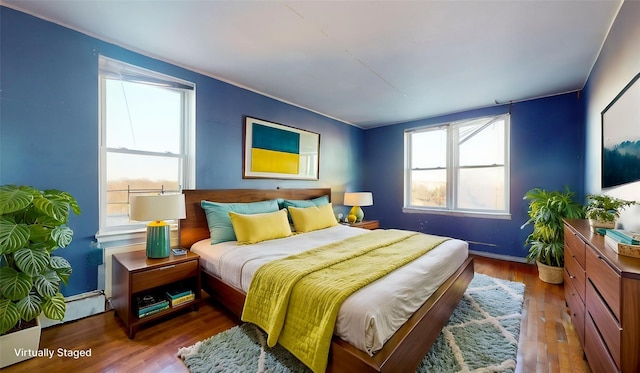 bedroom featuring wood-type flooring