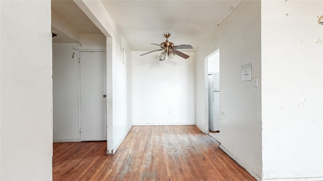 hall with wood-type flooring