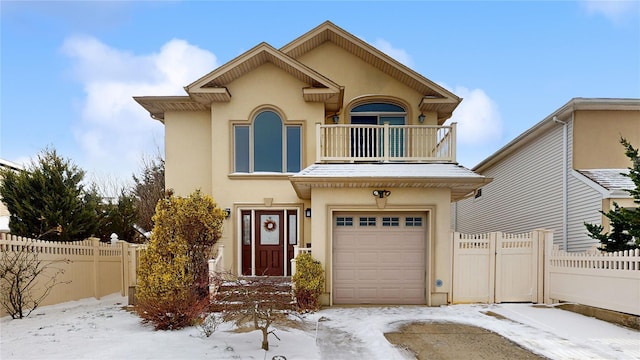 view of front of house with a balcony and a garage