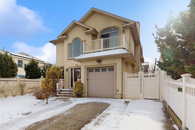 view of front of house with a balcony and a garage