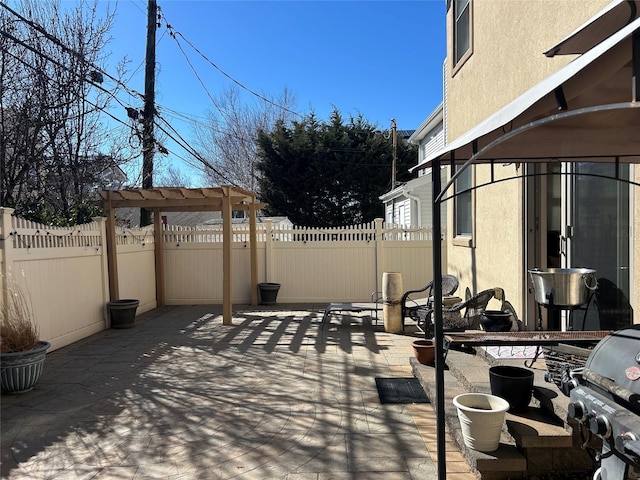 view of patio / terrace featuring fence and grilling area