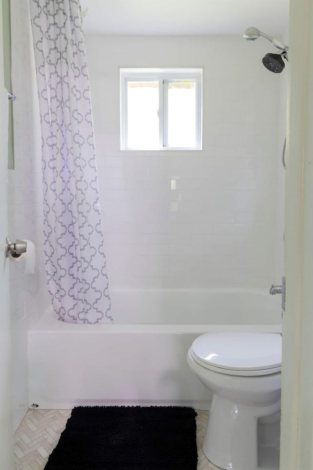 bathroom featuring toilet and shower / bathtub combination with curtain