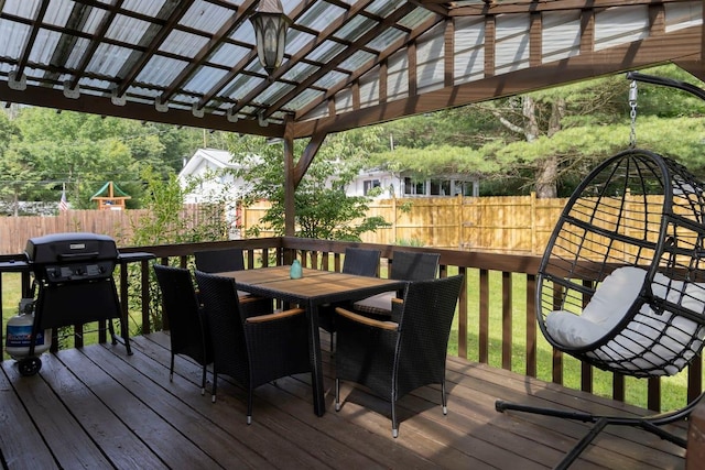 wooden deck featuring a grill