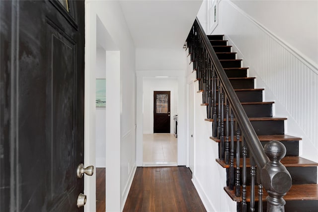 stairs featuring hardwood / wood-style flooring