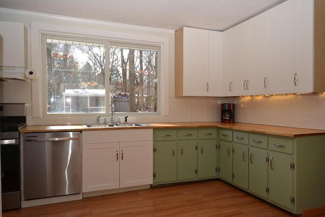 kitchen with sink, wooden counters, appliances with stainless steel finishes, white cabinets, and light wood-type flooring