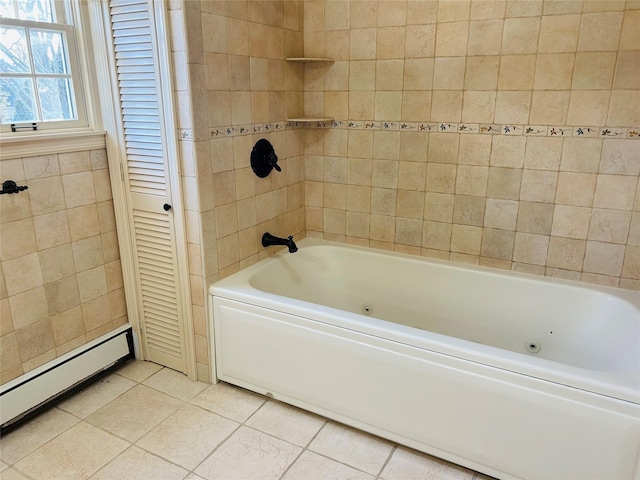 bathroom with a baseboard heating unit, tile walls, and tile patterned floors