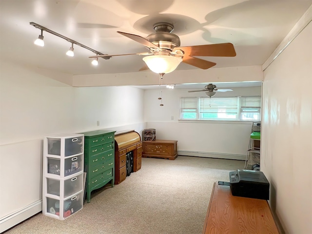 interior space with light carpet, rail lighting, ceiling fan, and a baseboard radiator