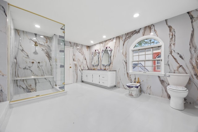 bathroom featuring toilet, a bidet, vanity, tile walls, and an enclosed shower