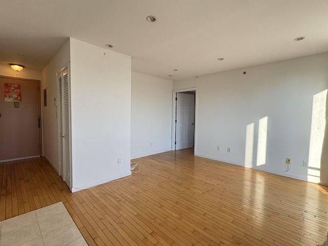 empty room with light wood-type flooring