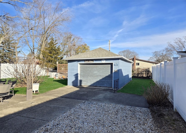 garage featuring a yard