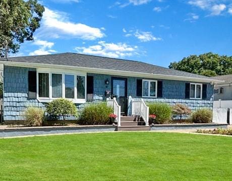 ranch-style home with a front yard