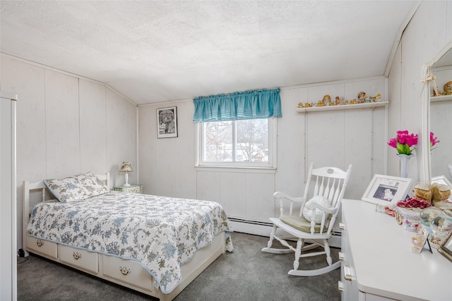 bedroom with wooden walls, carpet flooring, and a textured ceiling