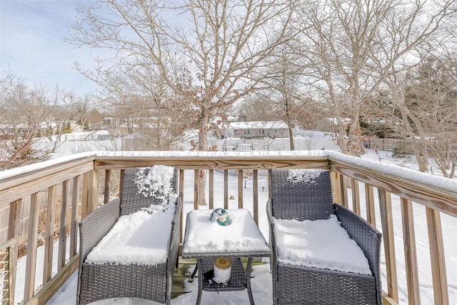 snow covered deck featuring grilling area