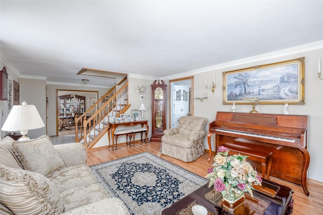 living room with light hardwood / wood-style flooring and ornamental molding