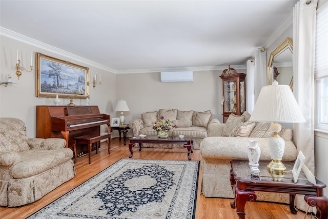 living room featuring a wall mounted air conditioner, a wealth of natural light, and light hardwood / wood-style floors