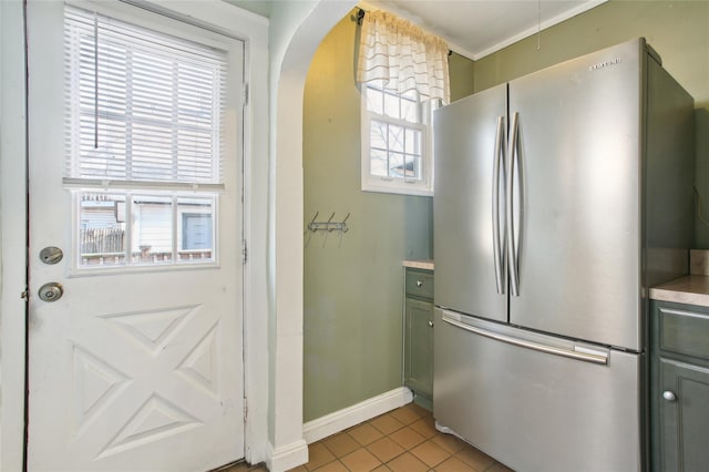 53 S Grove St S, Valley Stream, NY 11580 - kitchen featuring stainless steel refrigerator, light tile patterned flooring, and green cabinets