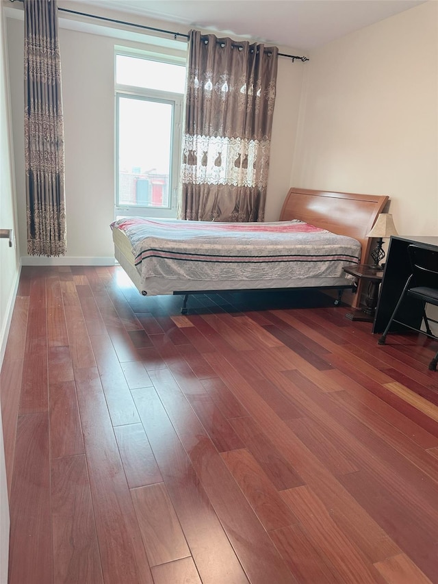 bedroom featuring wood-type flooring