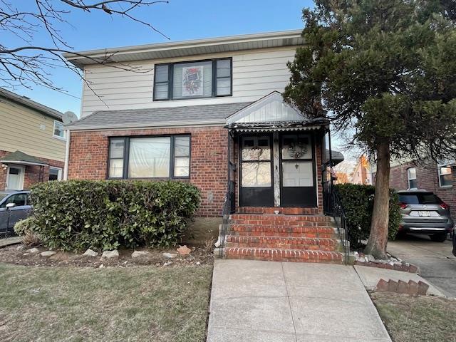 99 Gibson Blvd, Valley Stream, NY 11581 - traditional home with brick siding and entry steps