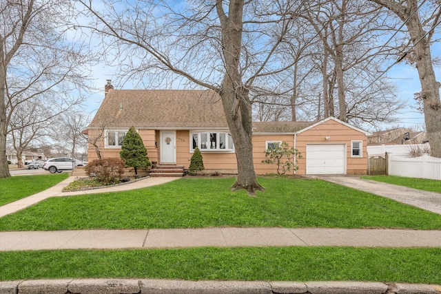 view of front facade featuring a garage and a front lawn