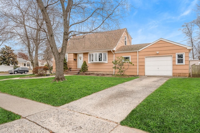 view of front of house with a front yard and a garage