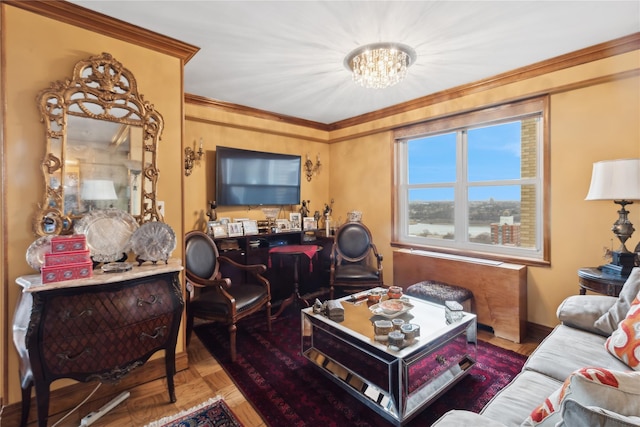 living room featuring crown molding, parquet floors, and a chandelier