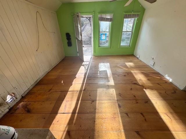 doorway to outside with vaulted ceiling, ceiling fan, plenty of natural light, and light wood-type flooring