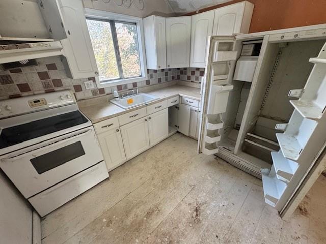 kitchen featuring white cabinetry, sink, electric range, and tasteful backsplash