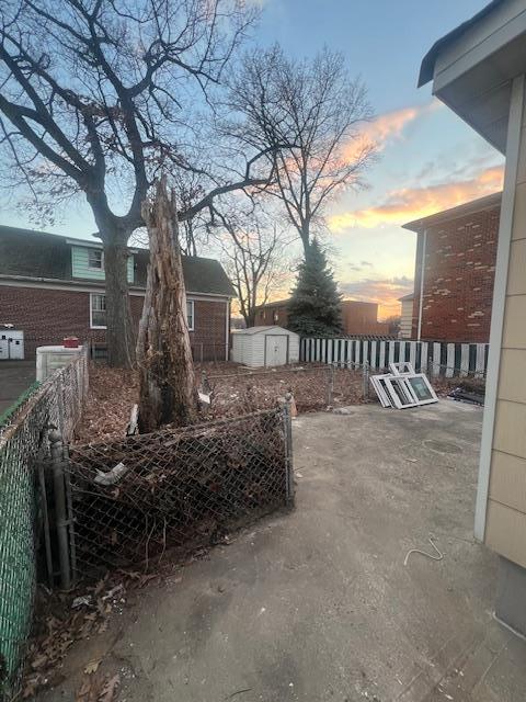 patio terrace at dusk with a storage unit