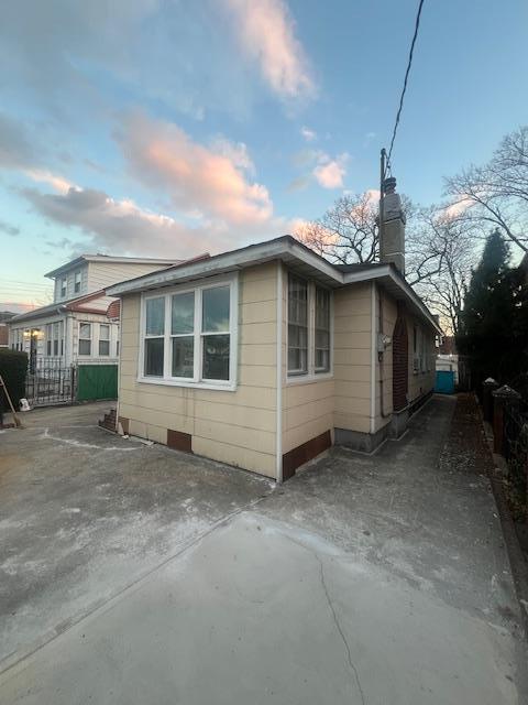 view of property exterior at dusk