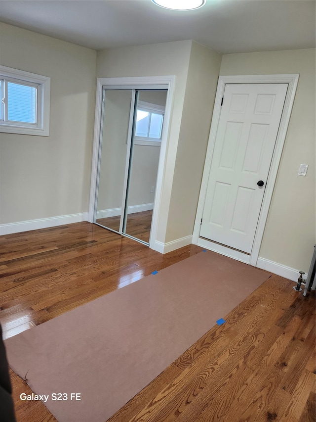 unfurnished bedroom featuring hardwood / wood-style floors