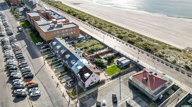 bird's eye view featuring a view of the beach and a water view