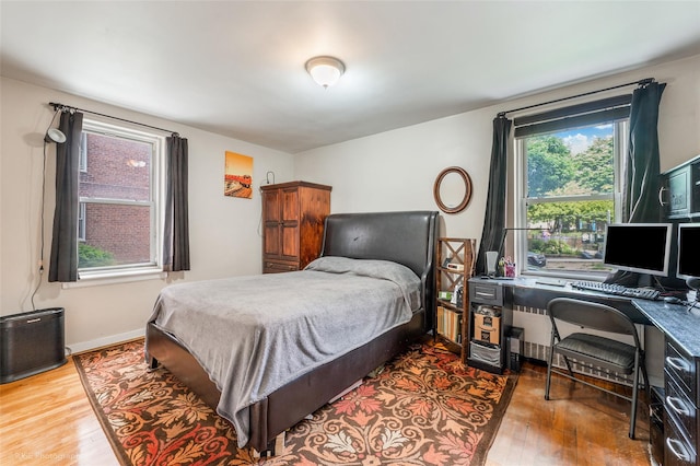 bedroom with wood-type flooring