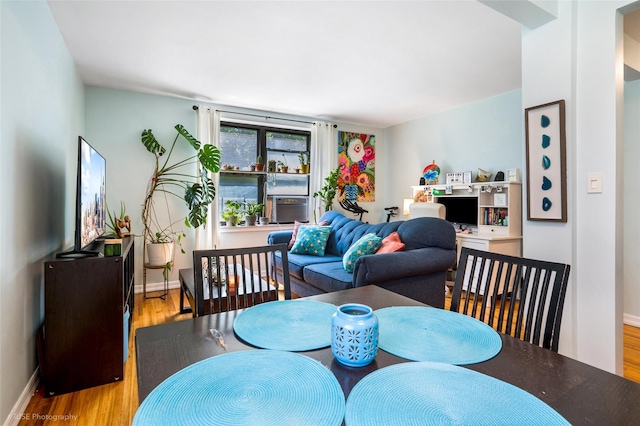 dining area with light wood-type flooring