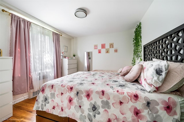 bedroom featuring light wood-type flooring