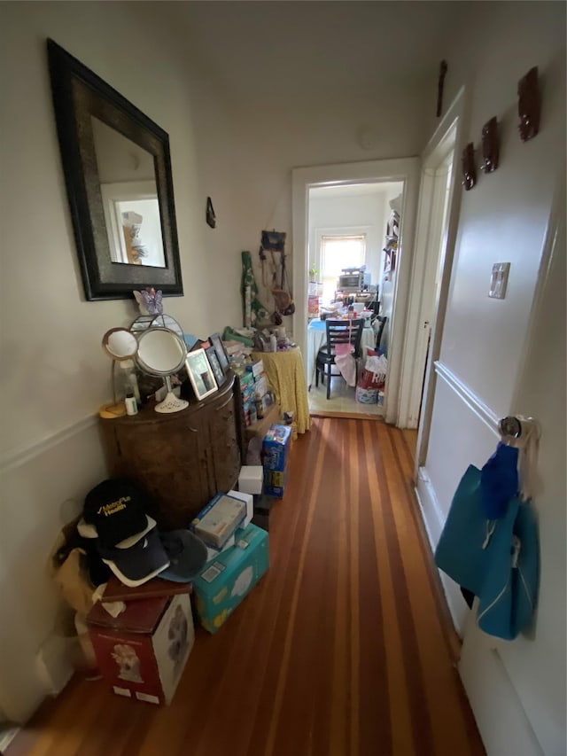 hall with hardwood / wood-style flooring